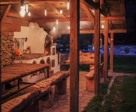 Rustic clay oven outside near forest at Biovaleputna guest house